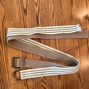 Mens pair of khaki/tan D-ring belts.